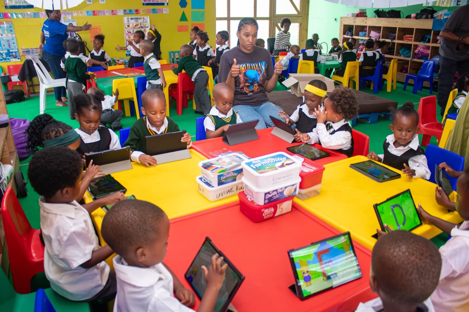 Children learning on iPads at the Sume Centre EduTech preschool classroom